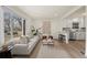 Open concept living area flows to the kitchen with stainless steel appliances at 4573 S Acoma St, Englewood, CO 80110