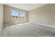 Bright bedroom with plush carpet and large windows offering scenic views at 17196 W 92Nd Loop, Arvada, CO 80007