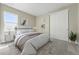 Cozy bedroom featuring soft carpet, light walls, a window, and closet with smooth doors at 17196 W 92Nd Loop, Arvada, CO 80007