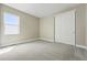 Clean bedroom with natural light, plush carpet, and a double door closet at 17196 W 92Nd Loop, Arvada, CO 80007