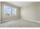 Comfortable bedroom with large windows, plush carpet, and ample natural light for a relaxing retreat at 17196 W 92Nd Loop, Arvada, CO 80007