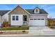 Attractive two-story home showcasing mixed brick and siding and a two-car garage at 17196 W 92Nd Loop, Arvada, CO 80007