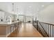 Open floor plan showing kitchen and living area filled with natural light and modern décor at 17196 W 92Nd Loop, Arvada, CO 80007