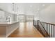 Open-concept living space featuring hardwood floors and sliding glass doors at 17196 W 92Nd Loop, Arvada, CO 80007