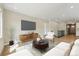 Cozy living area with modern furniture, TV, and hardwood floors at 17196 W 92Nd Loop, Arvada, CO 80007