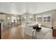 Open concept living and dining area with ample seating and natural light at 17196 W 92Nd Loop, Arvada, CO 80007