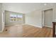 Spacious living room bathed in natural light from large windows with hardwood floors at 17196 W 92Nd Loop, Arvada, CO 80007