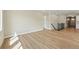 Large, open living room with hardwood floors, neutral walls, and plenty of space at 17196 W 92Nd Loop, Arvada, CO 80007