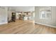 Expansive open-concept living space flowing into a modern kitchen with hardwood floors at 17196 W 92Nd Loop, Arvada, CO 80007