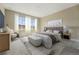 Serene main bedroom with neutral tones, soft carpet, and plenty of natural light at 17196 W 92Nd Loop, Arvada, CO 80007