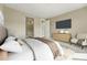 Comfortable bedroom with ensuite bathroom access, carpet, and simple furnishings at 17196 W 92Nd Loop, Arvada, CO 80007
