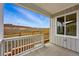 Covered patio with scenic views of the surrounding landscape and construction at 17196 W 92Nd Loop, Arvada, CO 80007