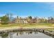 Building exterior view with a pond in the foreground at 4066 S Atchison Way # 102, Aurora, CO 80014