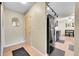 Entryway view with black appliances and hardwood floors at 4066 S Atchison Way # 102, Aurora, CO 80014
