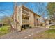 Tan condo building with two balconies and gravel landscaping at 4066 S Atchison Way # 102, Aurora, CO 80014
