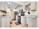 Bright kitchen with black appliances and white cabinets at 4066 S Atchison Way # 102, Aurora, CO 80014