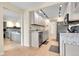Well-lit kitchen featuring light countertops, cabinets, stainless steel appliances, and hardwood flooring at 4066 S Atchison Way # 102, Aurora, CO 80014