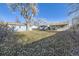 Large backyard with mature tree and detached garage at 4855 Dover St, Arvada, CO 80002