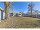 Spacious backyard with leaf covered lawn at 4855 Dover St, Arvada, CO 80002