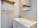 Simple bathroom with vanity, shelves and mirror at 4855 Dover St, Arvada, CO 80002