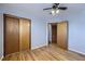 Bedroom with hardwood floors and closet at 4855 Dover St, Arvada, CO 80002