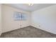 Spacious bedroom with grey carpet and window at 4855 Dover St, Arvada, CO 80002