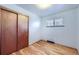 Bedroom with hardwood floors and double doors at 4855 Dover St, Arvada, CO 80002