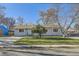 Ranch style home with a large yard and driveway at 4855 Dover St, Arvada, CO 80002