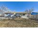 Ranch style home with covered patio at 4855 Dover St, Arvada, CO 80002