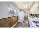 Efficient kitchen with white cabinets and wood flooring at 4855 Dover St, Arvada, CO 80002