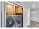 Laundry room with washer, dryer, and storage at 4855 Dover St, Arvada, CO 80002