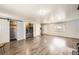 Bright living room featuring wood floors and laundry area at 4855 Dover St, Arvada, CO 80002