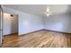 Bright living room with hardwood floors and ceiling fan at 4855 Dover St, Arvada, CO 80002