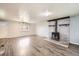 Living room with hardwood floors and a wood-burning stove at 4855 Dover St, Arvada, CO 80002