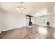 Spacious living room with wood floors and a fireplace at 4855 Dover St, Arvada, CO 80002