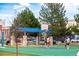 Active basketball court with players, trees, and well maintained play structure at 1642 N Lafayette St # 2, Denver, CO 80218