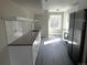 Modern kitchen with white cabinetry, subway tile backsplash, and stainless steel appliances at 1642 N Lafayette St # 2, Denver, CO 80218