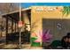 Exterior of Sushi Bay featuring outdoor seating, pink flower mural, and reserved parking sign at 1642 N Lafayette St # 2, Denver, CO 80218