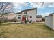 Wide backyard shows the patio with furniture and a shed, ideal for Gathering activities at 5826 Sunburst Ave, Firestone, CO 80504