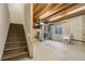 Unfinished basement featuring an open floor plan, utility sink and exposed ceiling at 5826 Sunburst Ave, Firestone, CO 80504