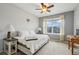 Neutral bedroom boasts a large window that provides plenty of natural light at 5826 Sunburst Ave, Firestone, CO 80504