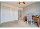 Neutral bedroom features large closet space and a desk to utilize as an office space at 5826 Sunburst Ave, Firestone, CO 80504
