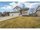 Attractive two-story home with a covered porch, manicured lawn, and a convenient two-car garage at 5826 Sunburst Ave, Firestone, CO 80504