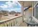 Cozy front porch with a quaint table, offering a perfect spot to relax and enjoy the neighborhood views at 5826 Sunburst Ave, Firestone, CO 80504