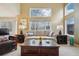 Bright living room with large windows offering views at 5826 Sunburst Ave, Firestone, CO 80504