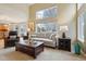 Spacious living room with high ceilings and large window offering plenty of sunlight at 5826 Sunburst Ave, Firestone, CO 80504