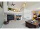 Cozy living area featuring a fireplace and open layout at 5826 Sunburst Ave, Firestone, CO 80504