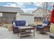 Cozy patio area with outdoor seating, perfect for relaxing and enjoying the backyard at 5826 Sunburst Ave, Firestone, CO 80504