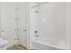 A clean and bright bathroom with a white tub and shower, featuring classic fixtures at 6187 E 155Th Pl, Thornton, CO 80602