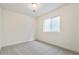 Cozy bedroom featuring a window for natural light and soft carpeted flooring at 6187 E 155Th Pl, Thornton, CO 80602